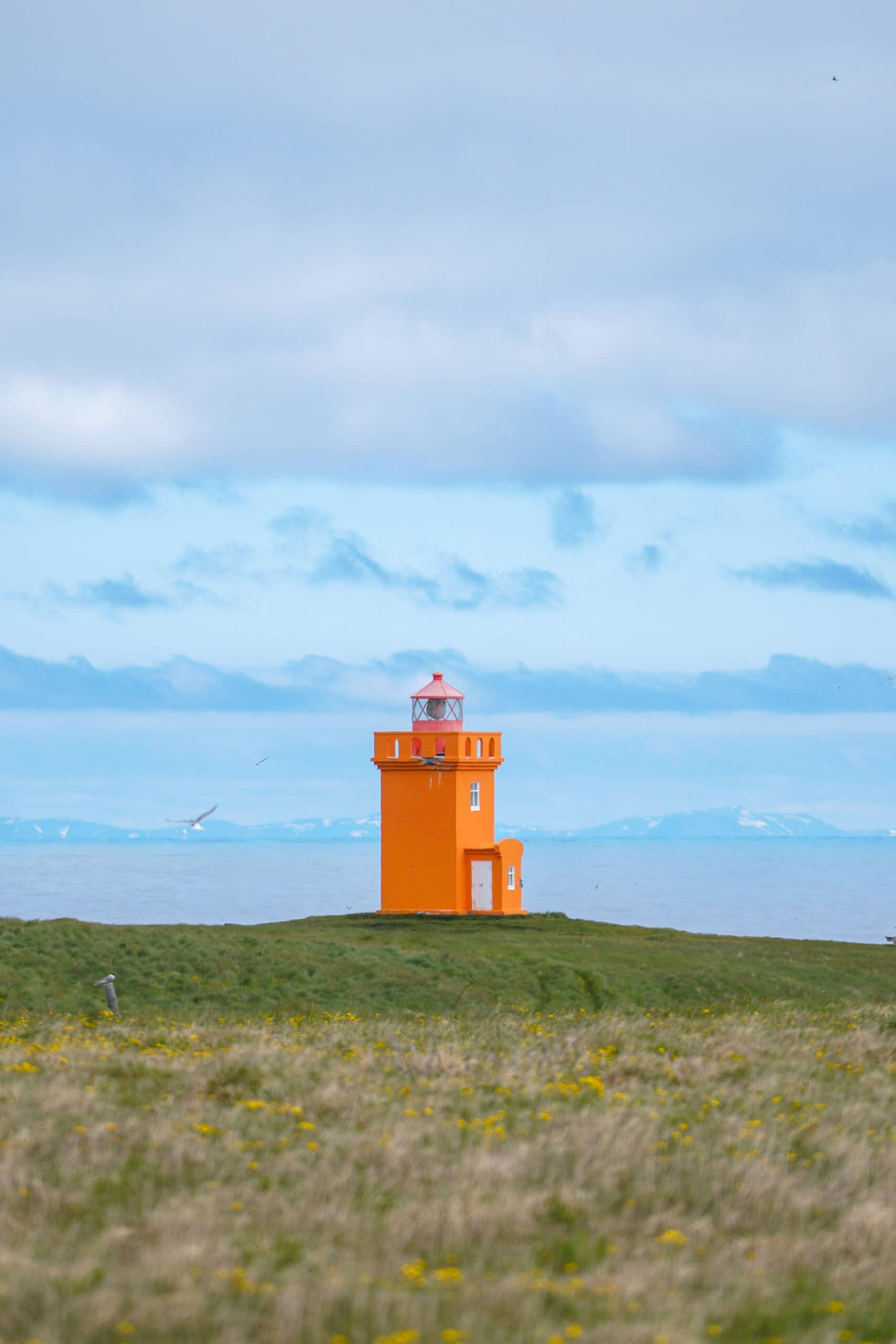 orange lighthouse on grimsey