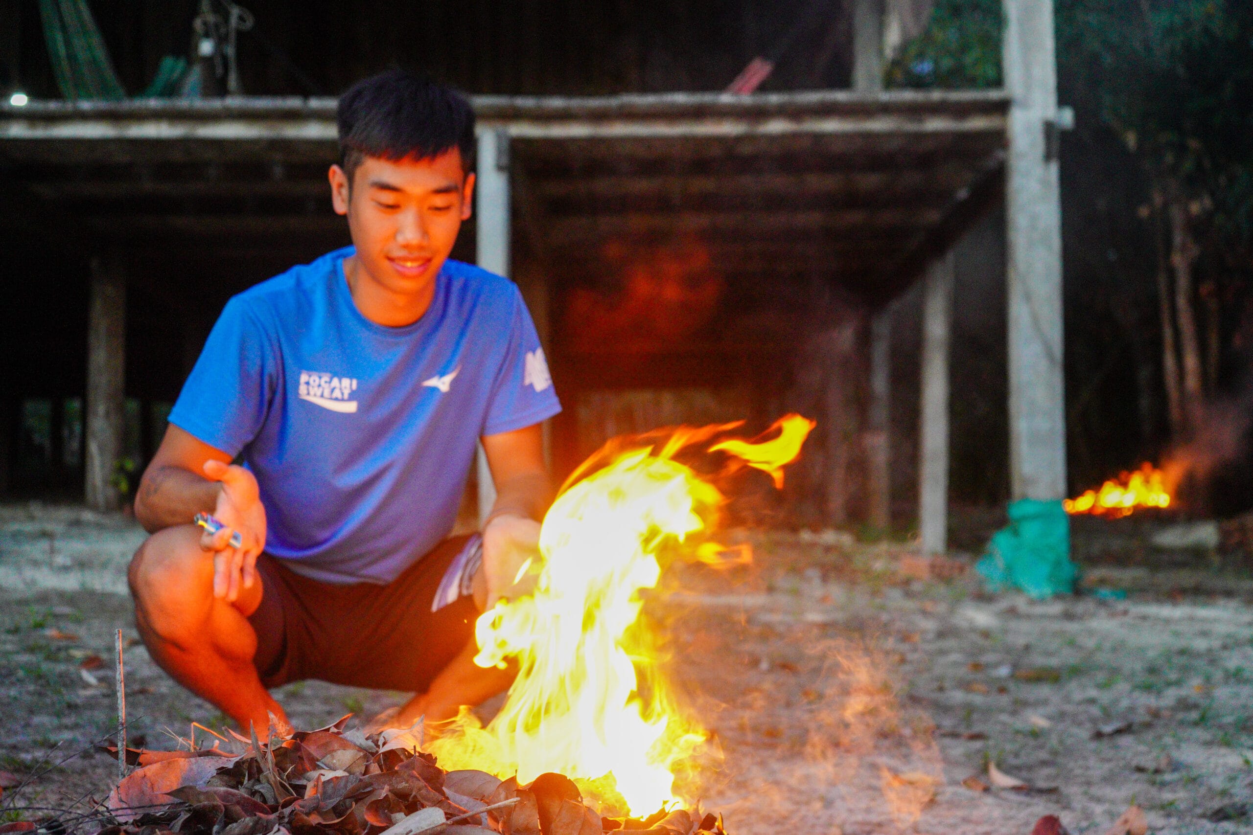 starting a fire to burn the leaves in Amazon forest